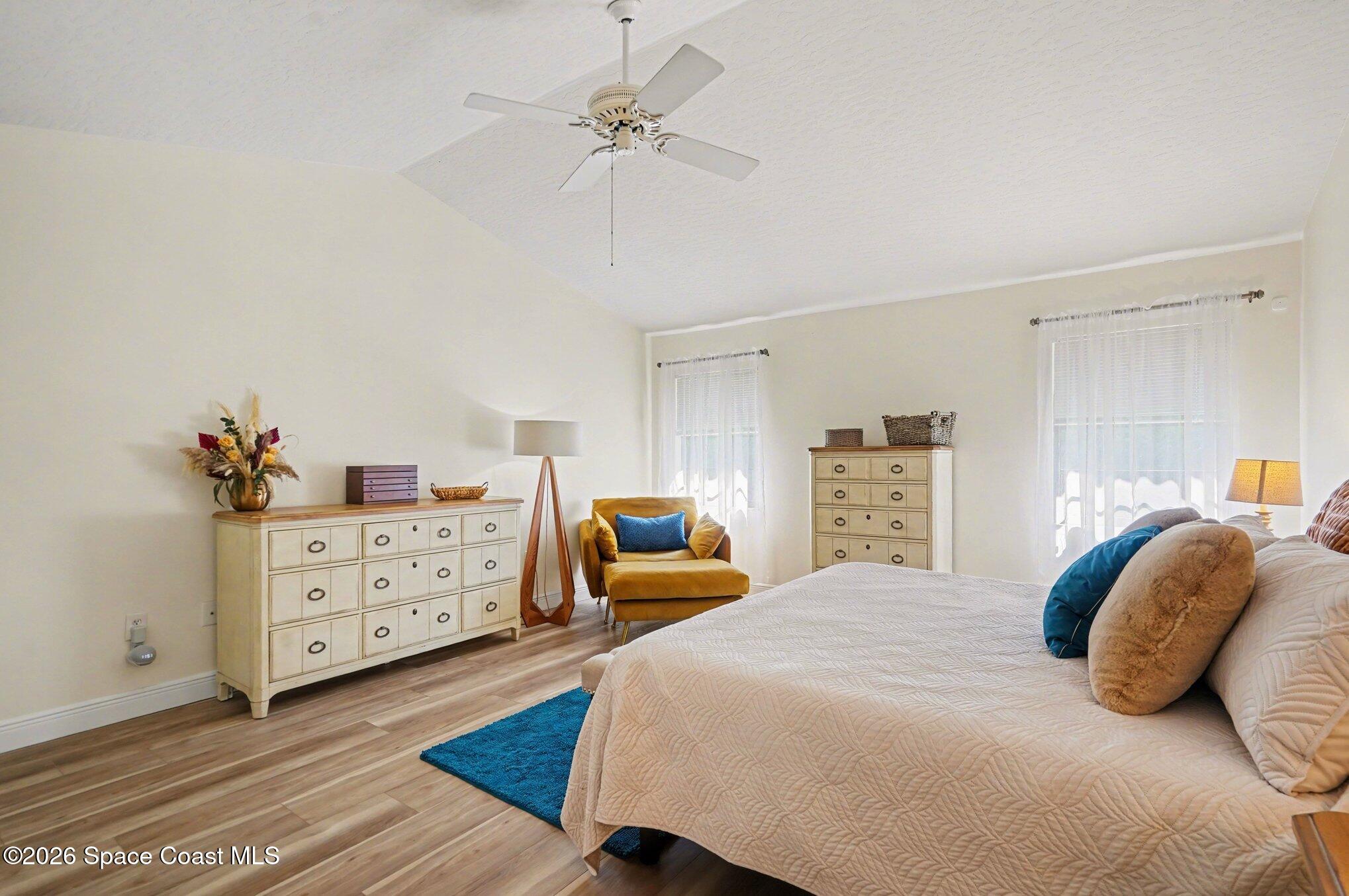 873 Ridge Lake Drive Melbourne, FL 32940 - Photo 15 of 27 a bedroom with a bed and a dresser
