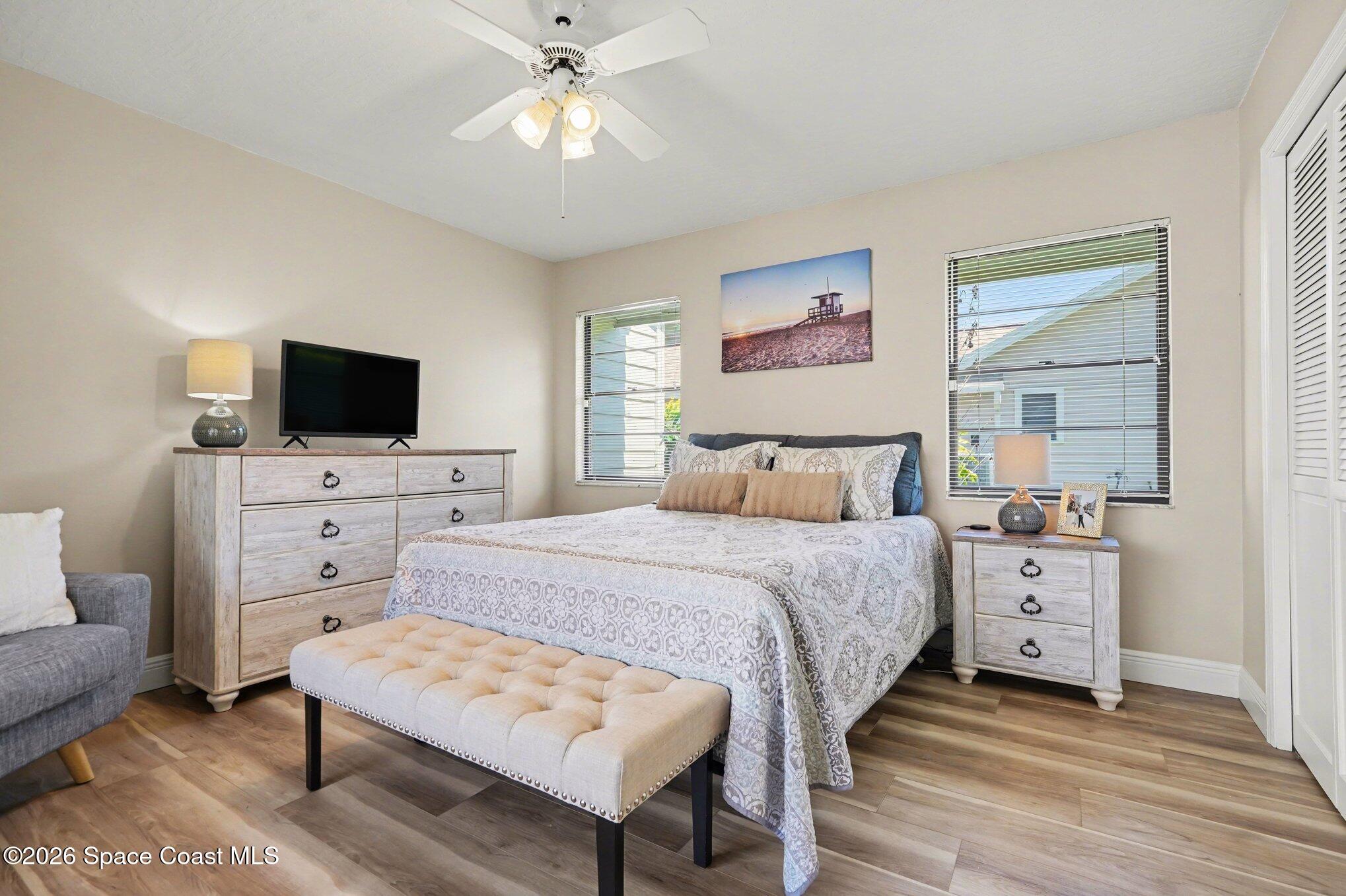 873 Ridge Lake Drive Melbourne, FL 32940 - Photo 18 of 27 a bedroom with a bed and a flat screen tv