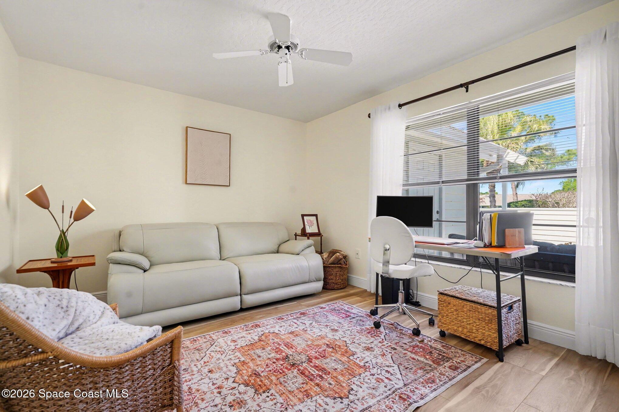 873 Ridge Lake Drive Melbourne, FL 32940 - Photo 21 of 27 a living room with furniture and a window