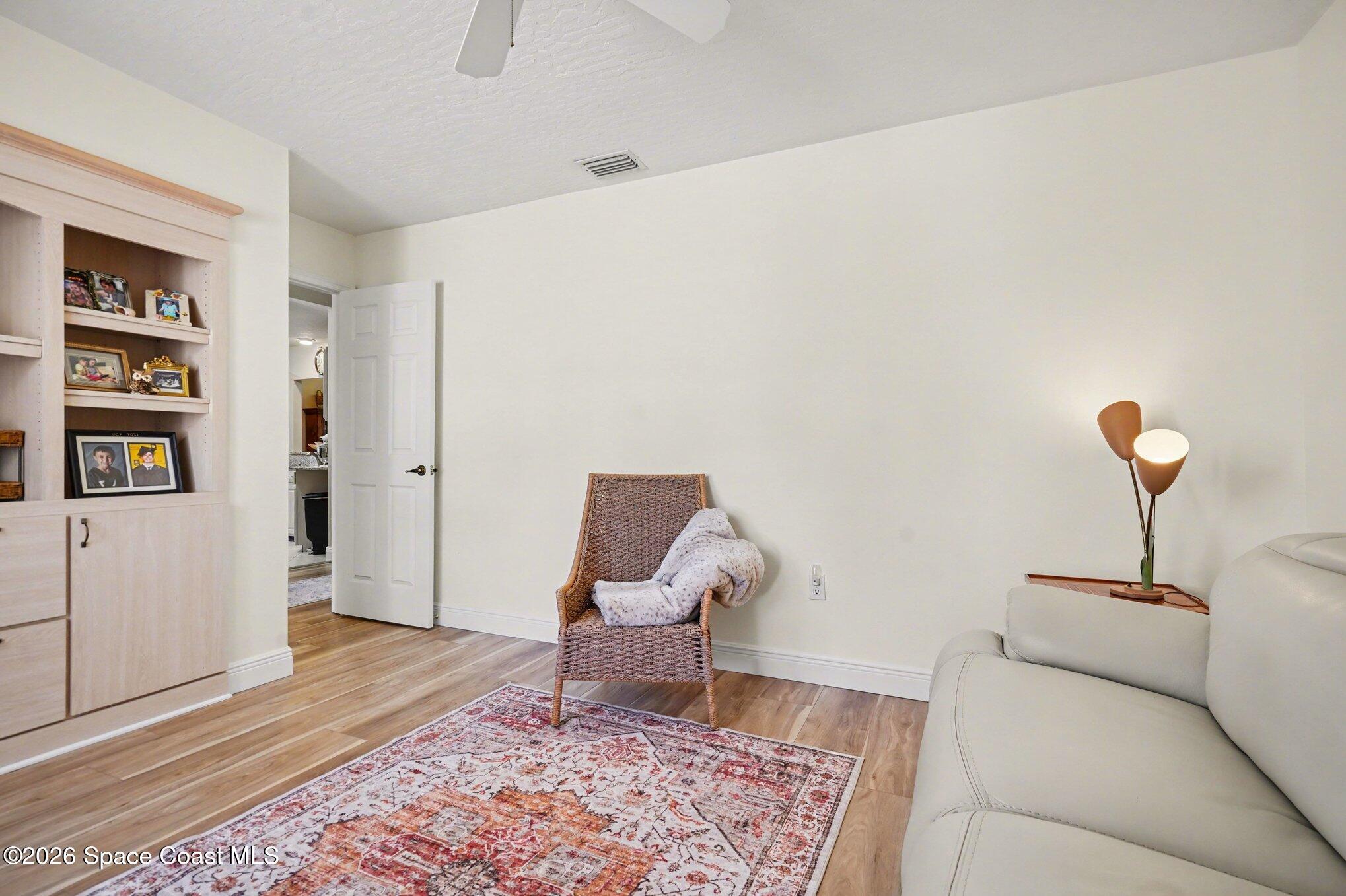 873 Ridge Lake Drive Melbourne, FL 32940 - Photo 22 of 27 a living room with furniture and a rug