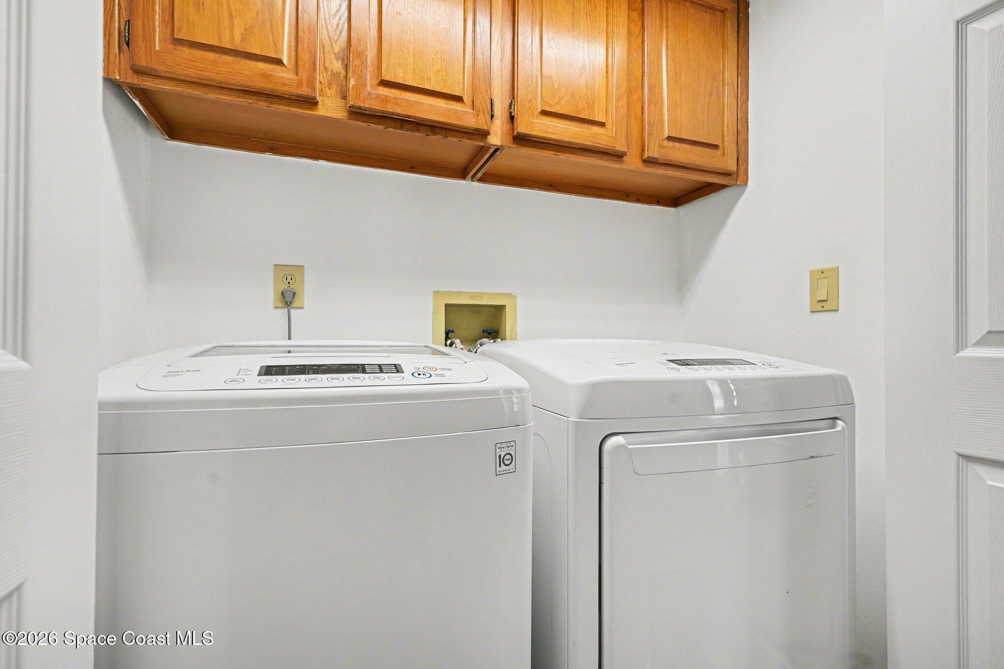 873 Ridge Lake Drive Melbourne, FL 32940 - Photo 23 of 27 a utility room with dryer and washer