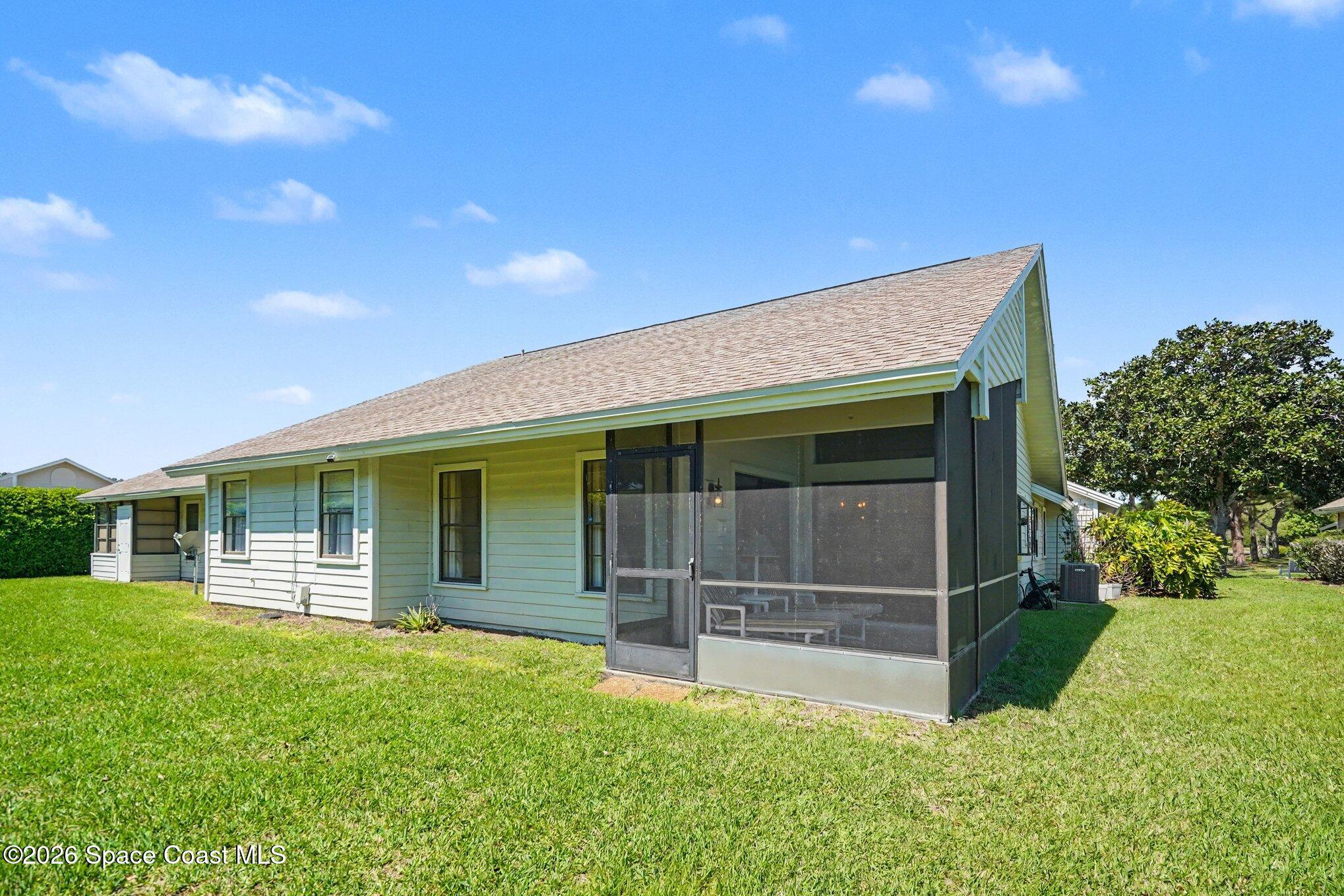 873 Ridge Lake Drive Melbourne, FL 32940 - Photo 26 of 27 a view of a house with a yard