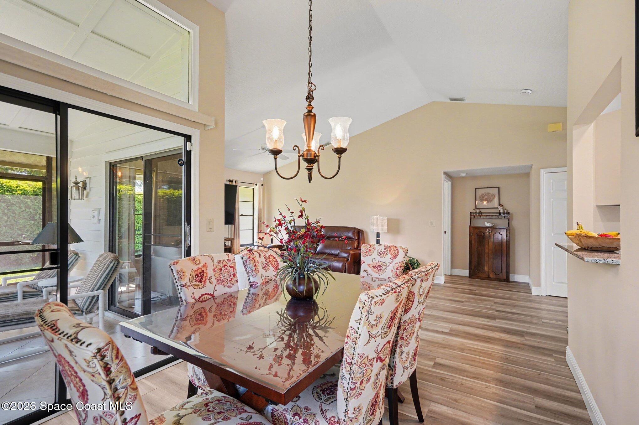 873 Ridge Lake Drive Melbourne, FL 32940 - Photo 8 of 27 a view of a dining room with furniture and wooden floor