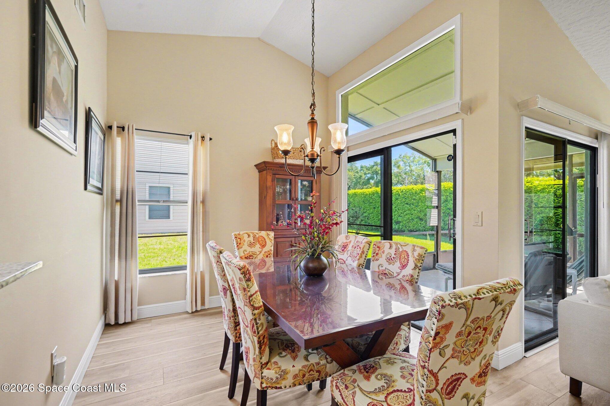 873 Ridge Lake Drive Melbourne, FL 32940 - Photo 9 of 27 a view of a dining room with furniture window and outside view