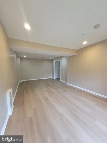 a large brick building with a yard in front of it