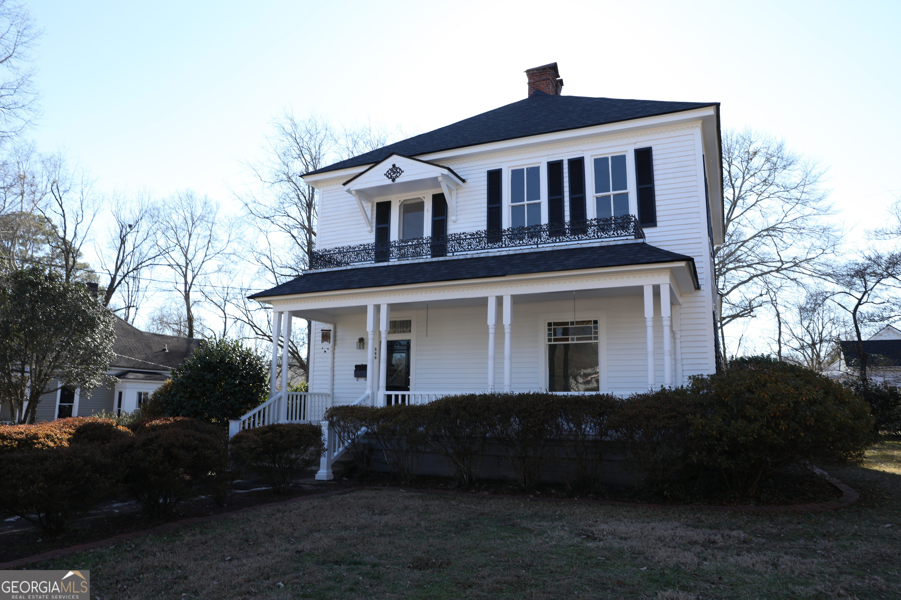 568 Foster Street Madison, GA 30650 - Photo 1 of 1 a front view of a house with a yard
