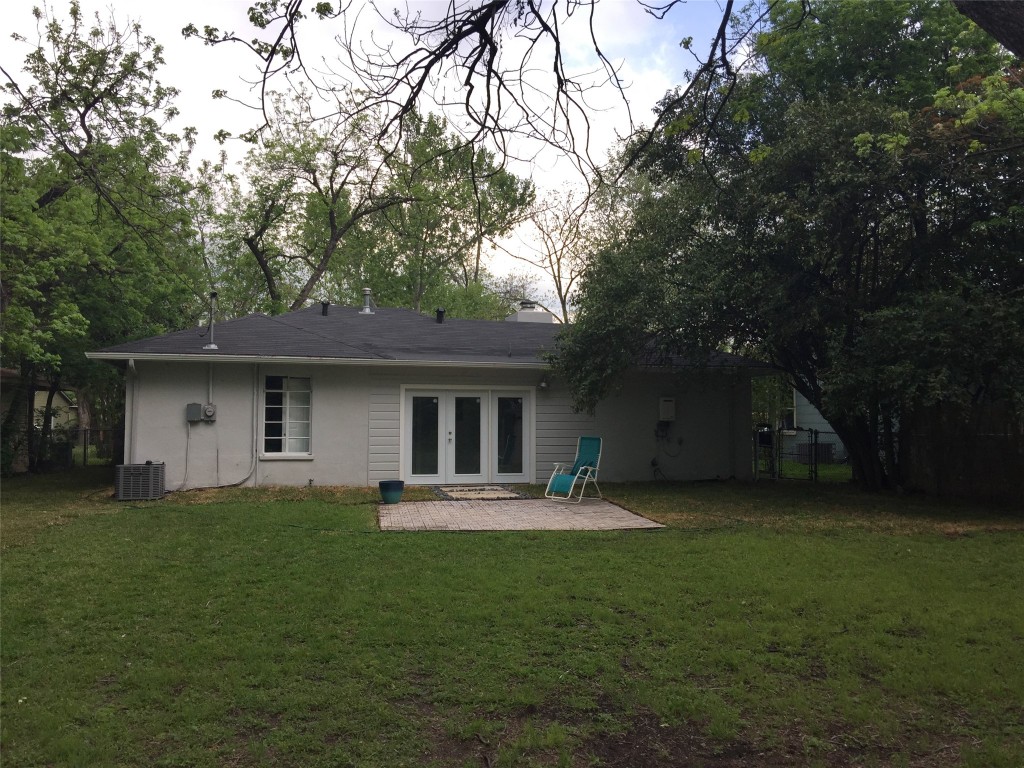 3705 Grayson Lane Austin, TX 78722 - Photo 17 of 17 a front view of a house with a garden and trees