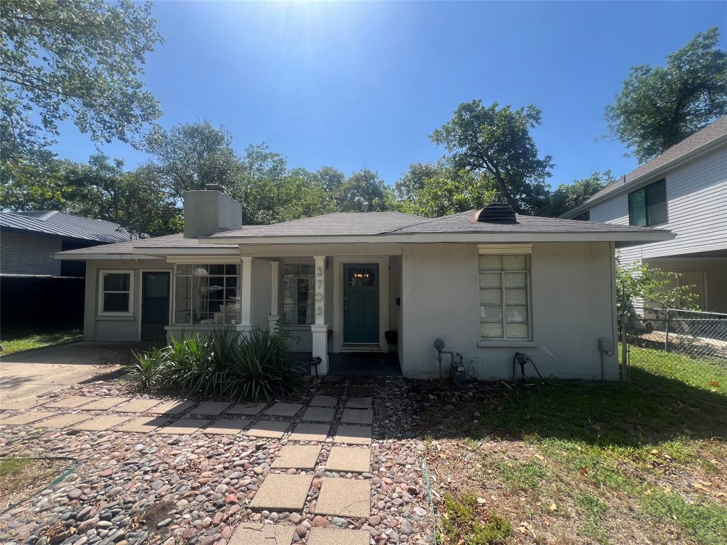 3705 Grayson Lane Austin, TX 78722 - Photo 2 of 17 a view of a house with backyard and garden
