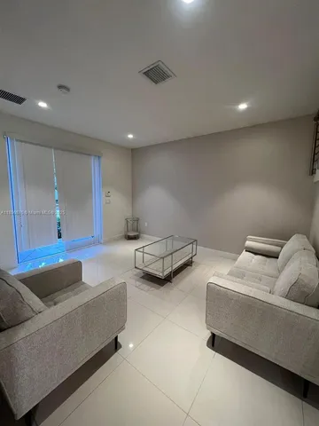 a living room with furniture and a couch