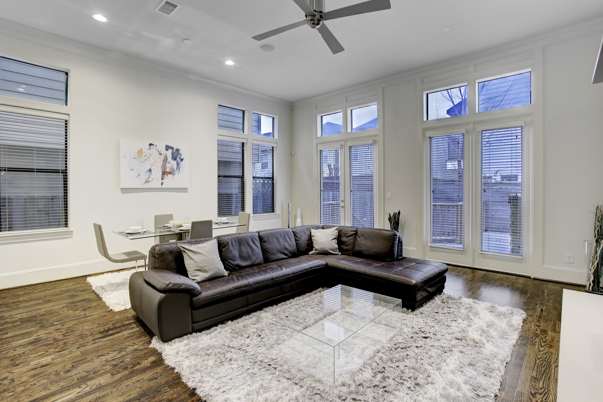 5506 Darling Street Houston, TX 77007 - Photo 23 of 23 Living & Dining Areas showcase the open floorplan with 12 ft. ceilings, ceiling fan and hardwood floors.