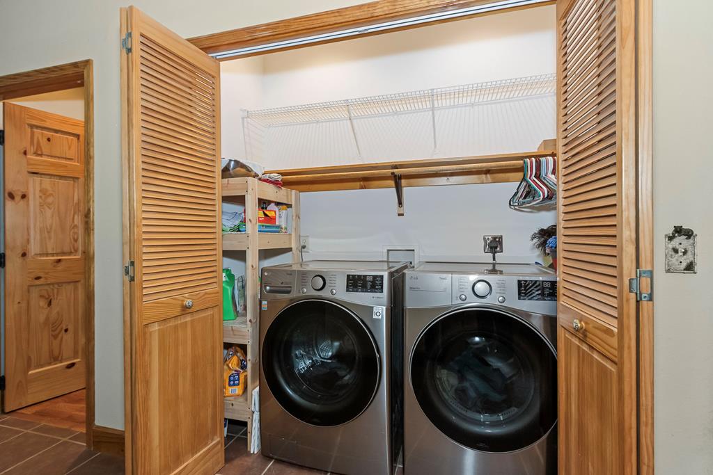 297 Lovingood Road Marble, NC 28905 - Photo 19 of 91 a utility room with dryer and washer