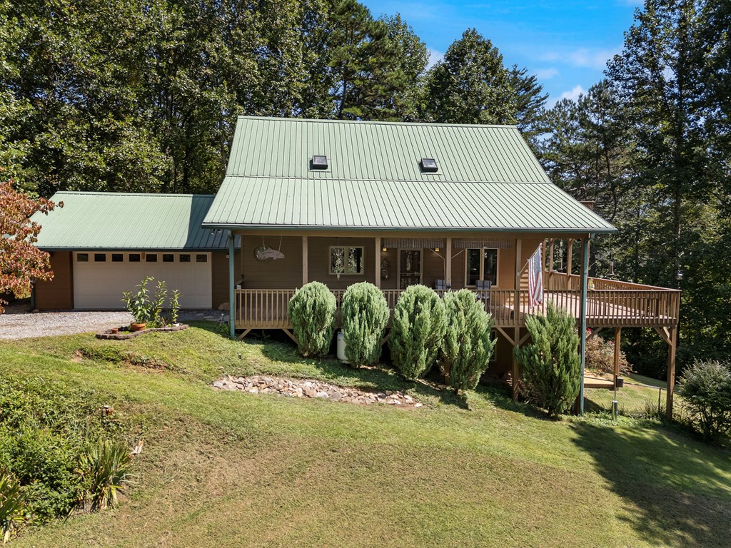 297 Lovingood Road Marble, NC 28905 - Photo 2 of 91 a front view of a house with garden