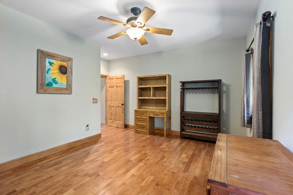 297 Lovingood Road Marble, NC 28905 - Photo 25 of 91 a view of a bedroom with furniture and ceiling fan