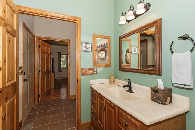 a bathroom with a sink and a mirror