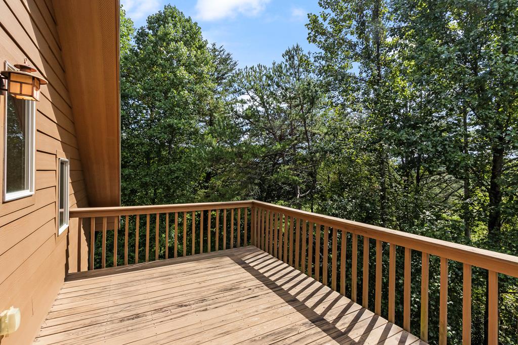 297 Lovingood Road Marble, NC 28905 - Photo 35 of 91 a balcony with wooden floor and fence