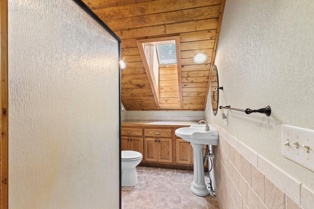 297 Lovingood Road Marble, NC 28905 - Photo 40 of 91 a bathroom with a sink a toilet and tub
