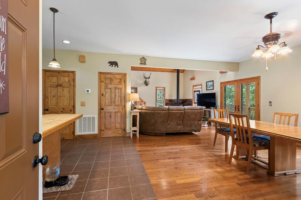 297 Lovingood Road Marble, NC 28905 - Photo 4 of 91 a living room with furniture a flat screen tv and a sink