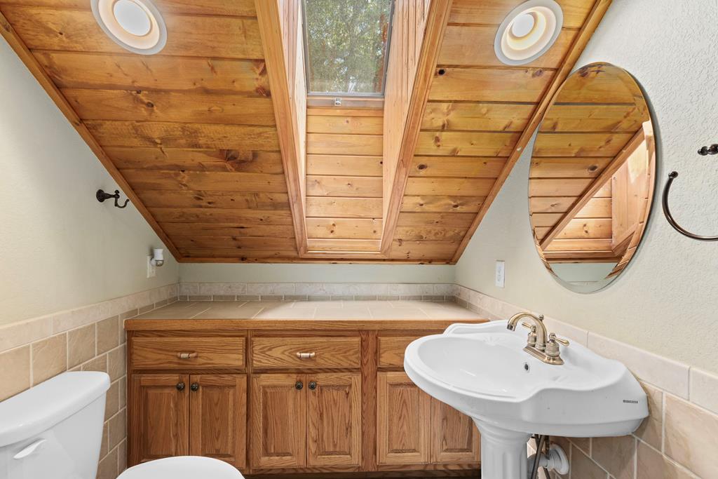 297 Lovingood Road Marble, NC 28905 - Photo 41 of 91 a bathroom with a sink and a mirror
