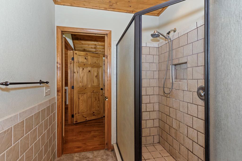 297 Lovingood Road Marble, NC 28905 - Photo 42 of 91 a bathroom with a shower