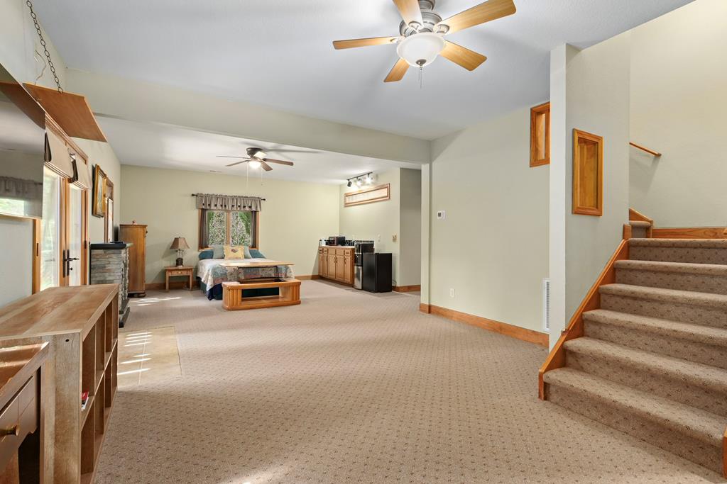 297 Lovingood Road Marble, NC 28905 - Photo 43 of 91 a view of a livingroom with furniture and a ceiling fan
