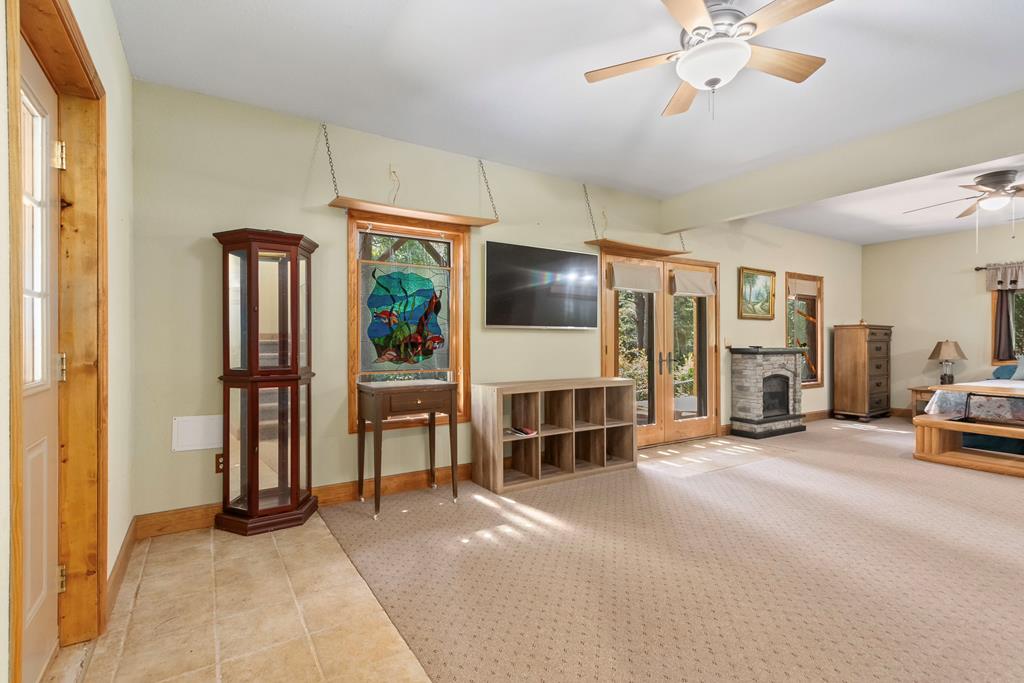 297 Lovingood Road Marble, NC 28905 - Photo 44 of 91 a view of a livingroom with furniture and a ceiling fan