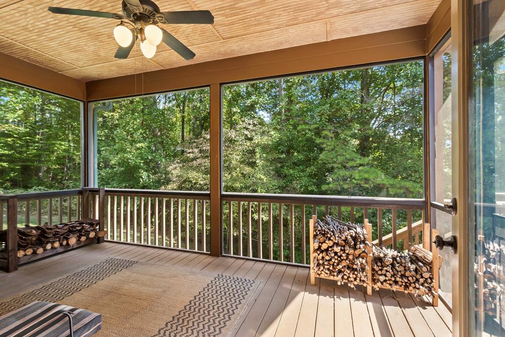 297 Lovingood Road Marble, NC 28905 - Photo 73 of 91 a balcony with wooden floor chairs and a table