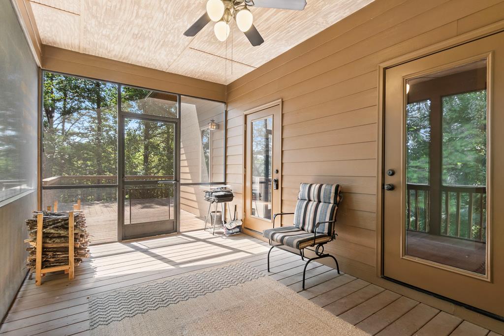 297 Lovingood Road Marble, NC 28905 - Photo 75 of 91 a living room with furniture and a floor to ceiling window