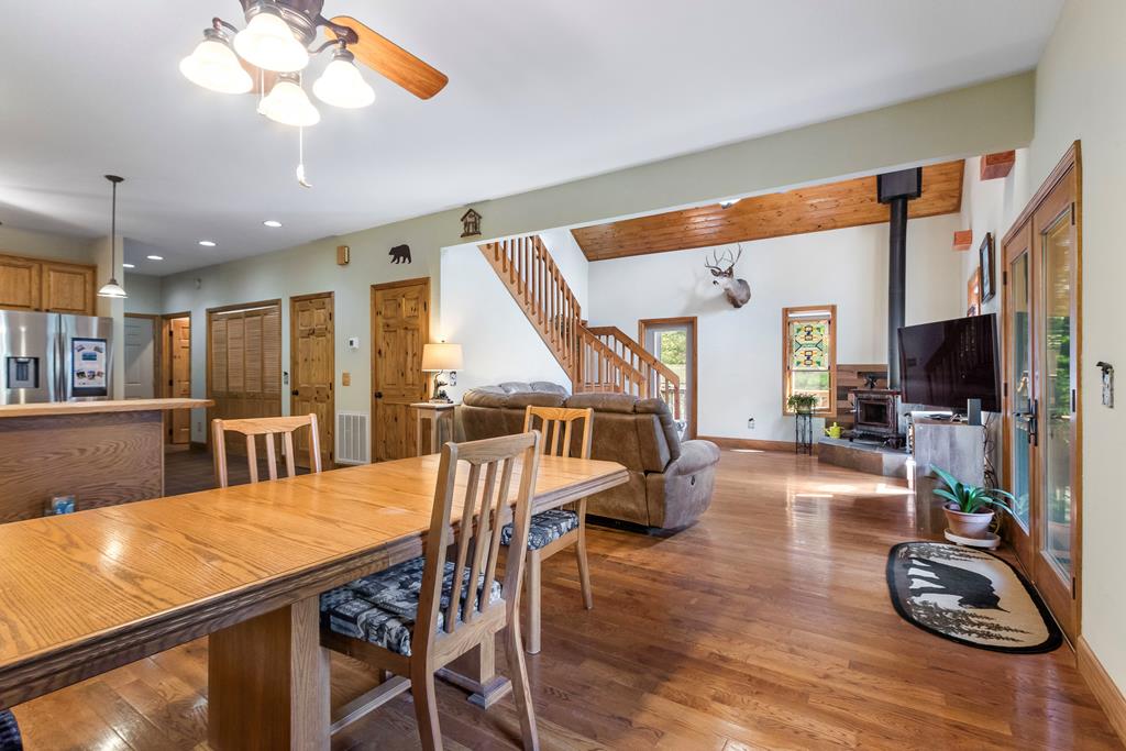 297 Lovingood Road Marble, NC 28905 - Photo 10 of 91 a view of a dining room with furniture a chandelier and wooden floor