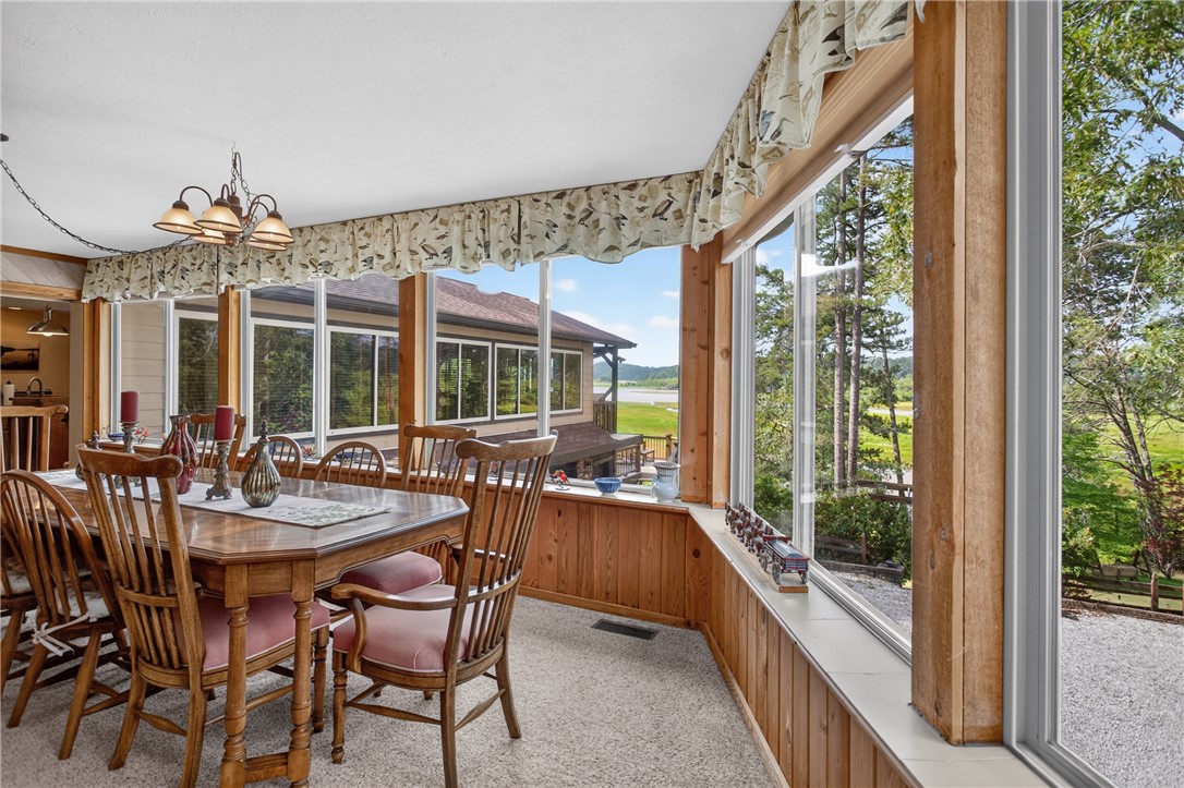 351 River Road Westminster, SC 29693 - Photo 11 of 50 A spacious dining area offers sweeping outdoor views through numerous picture windows.