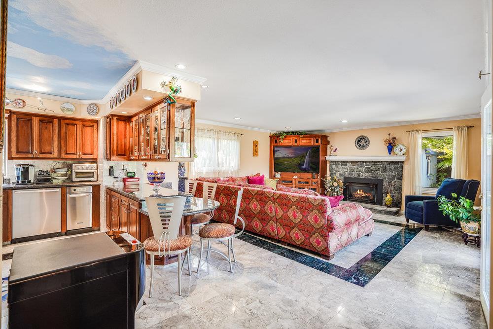 1893 Anthony Court Mountain View, CA 94040 - Photo 12 of 38 a bed room with furniture and a fireplace