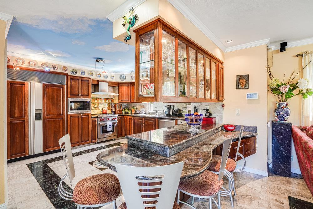 1893 Anthony Court Mountain View, CA 94040 - Photo 13 of 38 a room with stainless steel appliances kitchen island granite countertop furniture and a large window