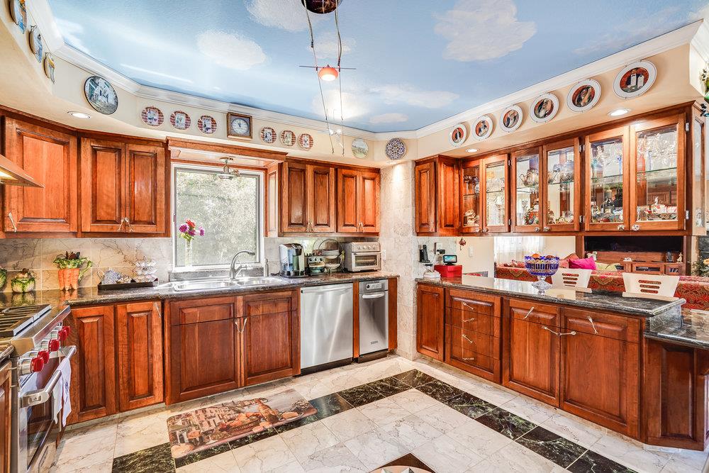1893 Anthony Court Mountain View, CA 94040 - Photo 14 of 38 a kitchen with lots of counter top space and wooden floor