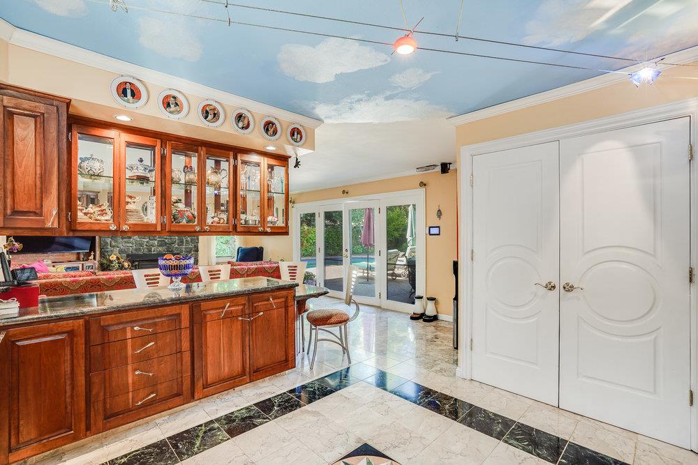 1893 Anthony Court Mountain View, CA 94040 - Photo 15 of 38 a kitchen with a sink a refrigerator and wooden cabinets