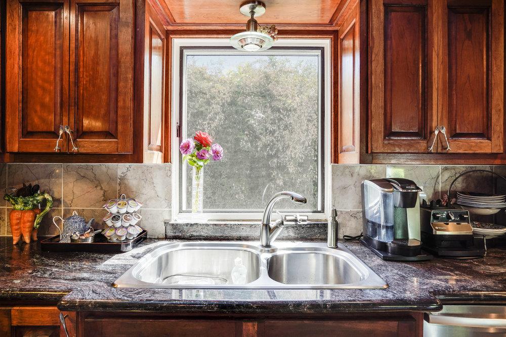 1893 Anthony Court Mountain View, CA 94040 - Photo 17 of 38 a kitchen with granite countertop a sink stainless steel appliances granite counter tops and a wooden cabinets