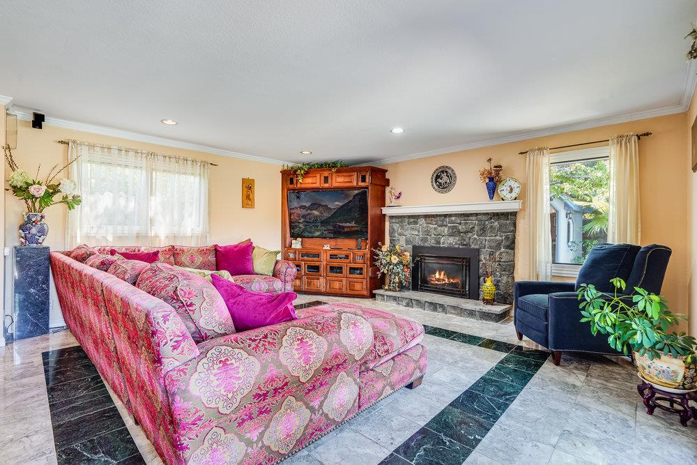 1893 Anthony Court Mountain View, CA 94040 - Photo 18 of 38 a living room with furniture fireplace and a large window