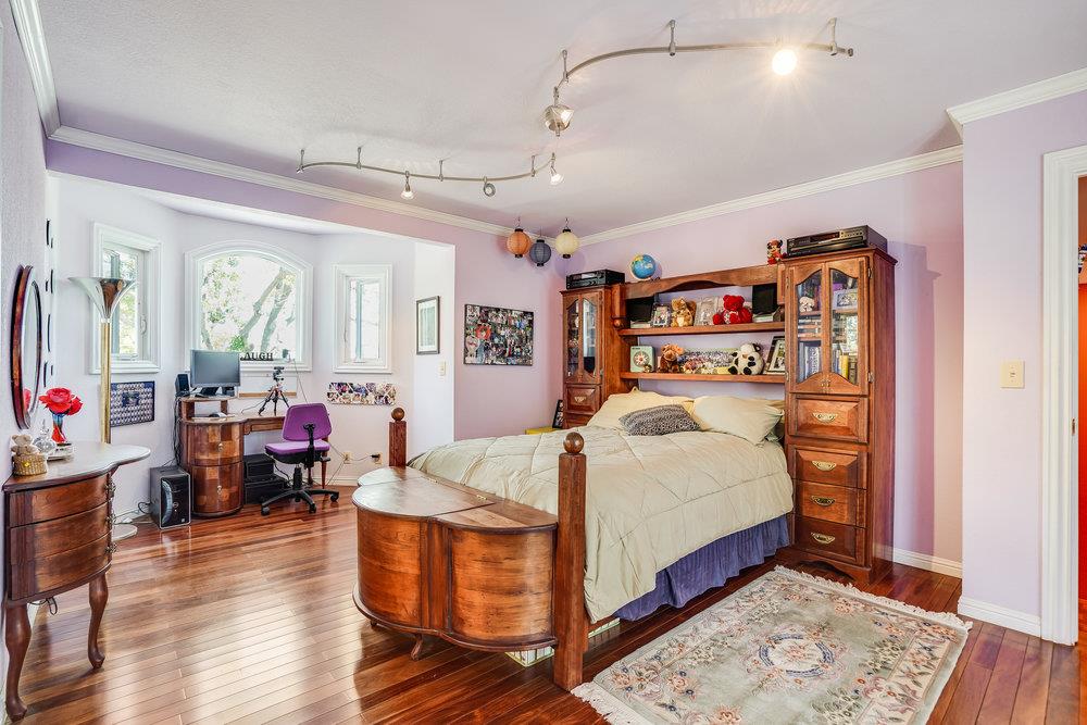 1893 Anthony Court Mountain View, CA 94040 - Photo 25 of 38 a bedroom with a bed closet and wooden floor