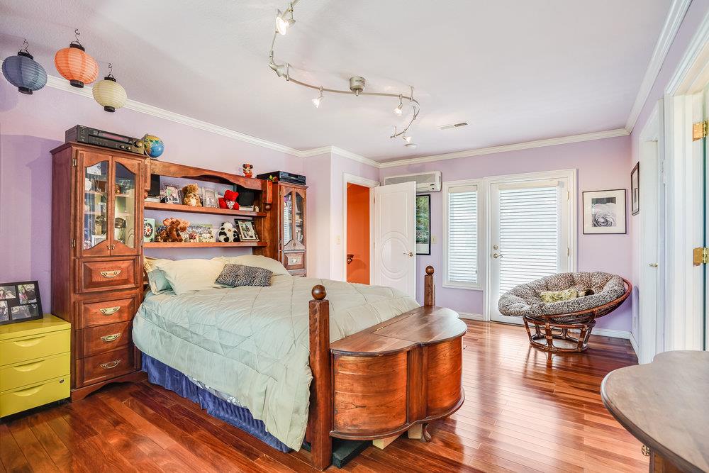 1893 Anthony Court Mountain View, CA 94040 - Photo 26 of 38 a bedroom with a bed and wooden floor