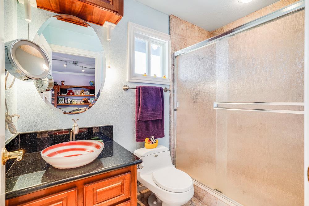1893 Anthony Court Mountain View, CA 94040 - Photo 27 of 38 a bathroom with a toilet a sink and a mirror