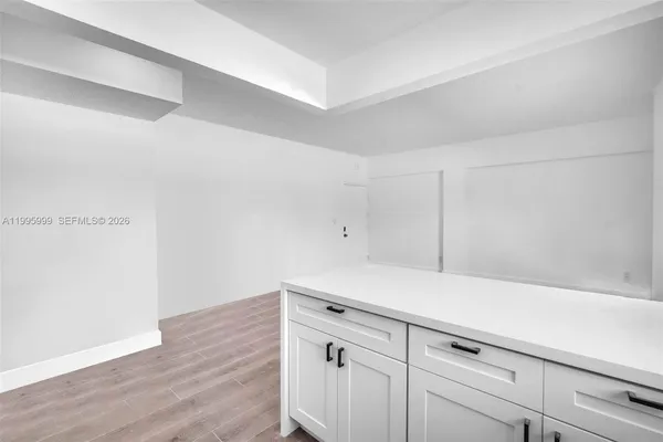 a view of cabinets with wooden floor