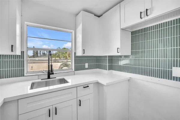 a view of a sink under an entryway