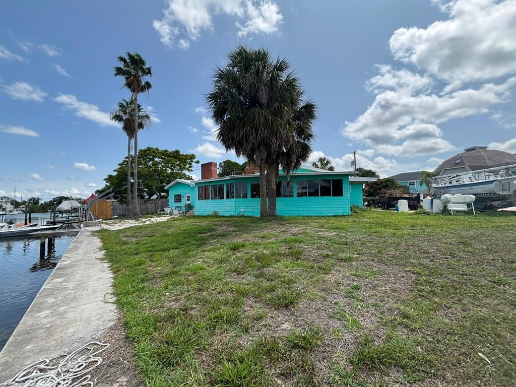 4447 Bahama Drive Hernando Beach, FL 34607 - Photo 18 of 31 a view of a house with a yard