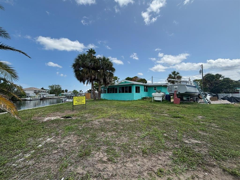 4447 Bahama Drive Hernando Beach, FL 34607 - Photo 19 of 31 a childrens park with lots of swings and slides