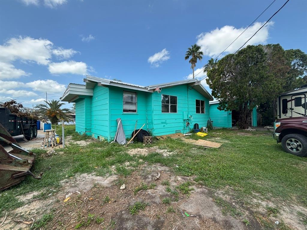 4447 Bahama Drive Hernando Beach, FL 34607 - Photo 21 of 31 a view of a house with a backyard and sitting area