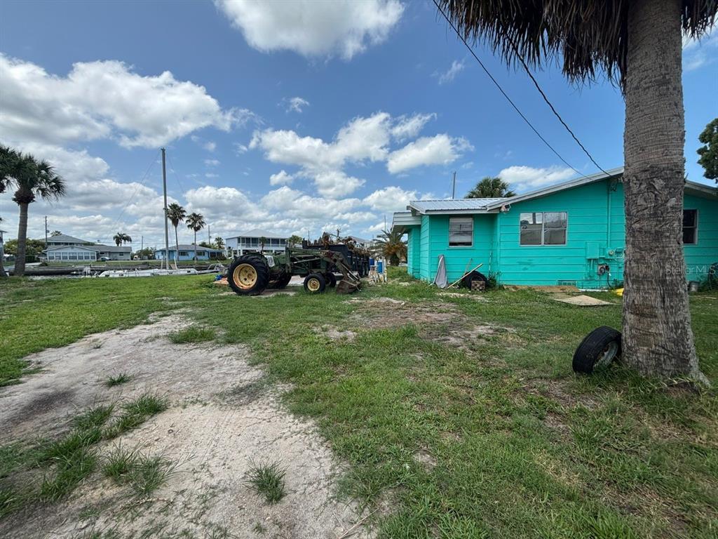 4447 Bahama Drive Hernando Beach, FL 34607 - Photo 22 of 31 a view of a house with a yard