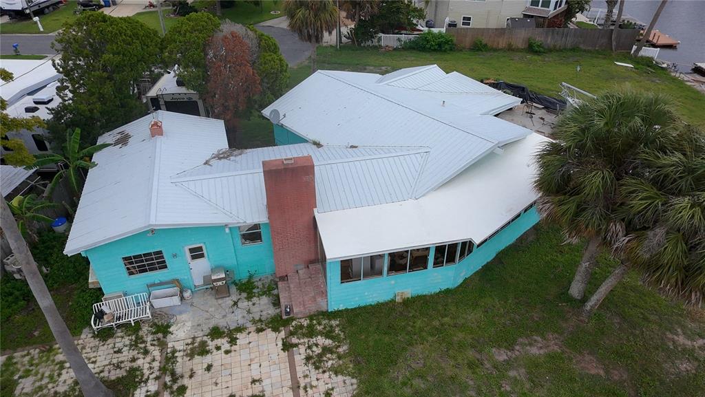 4447 Bahama Drive Hernando Beach, FL 34607 - Photo 24 of 31 an aerial view of a house with garden space and a house