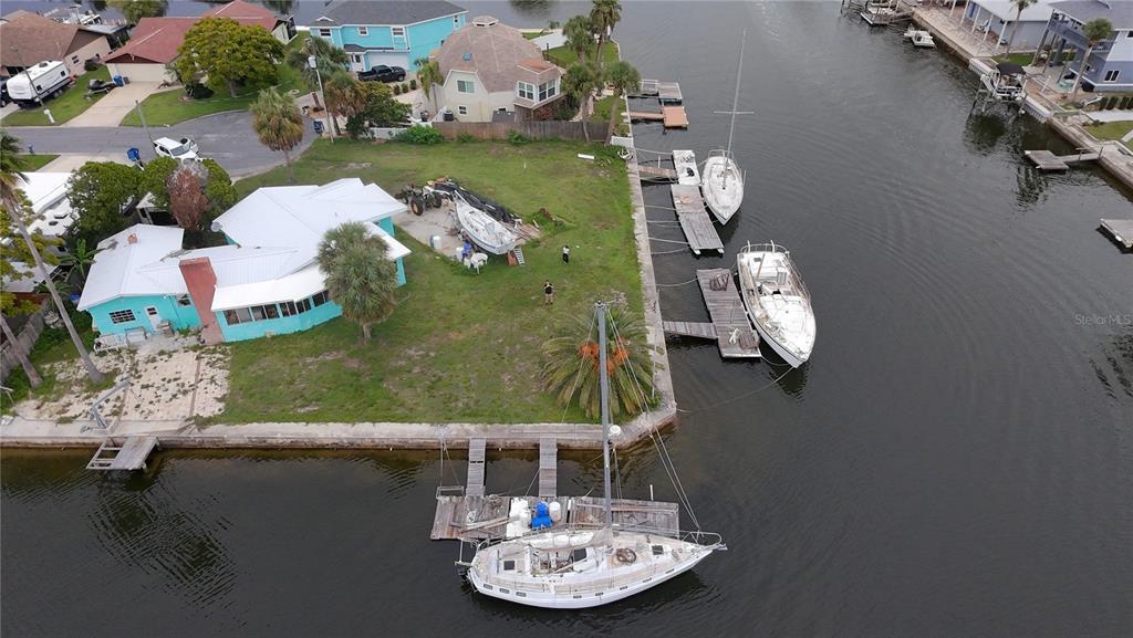 4447 Bahama Drive Hernando Beach, FL 34607 - Photo 27 of 31 an aerial view of a house with a yard swimming pool and outdoor seating