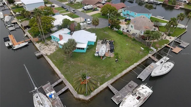 an aerial view of a house with a yard
