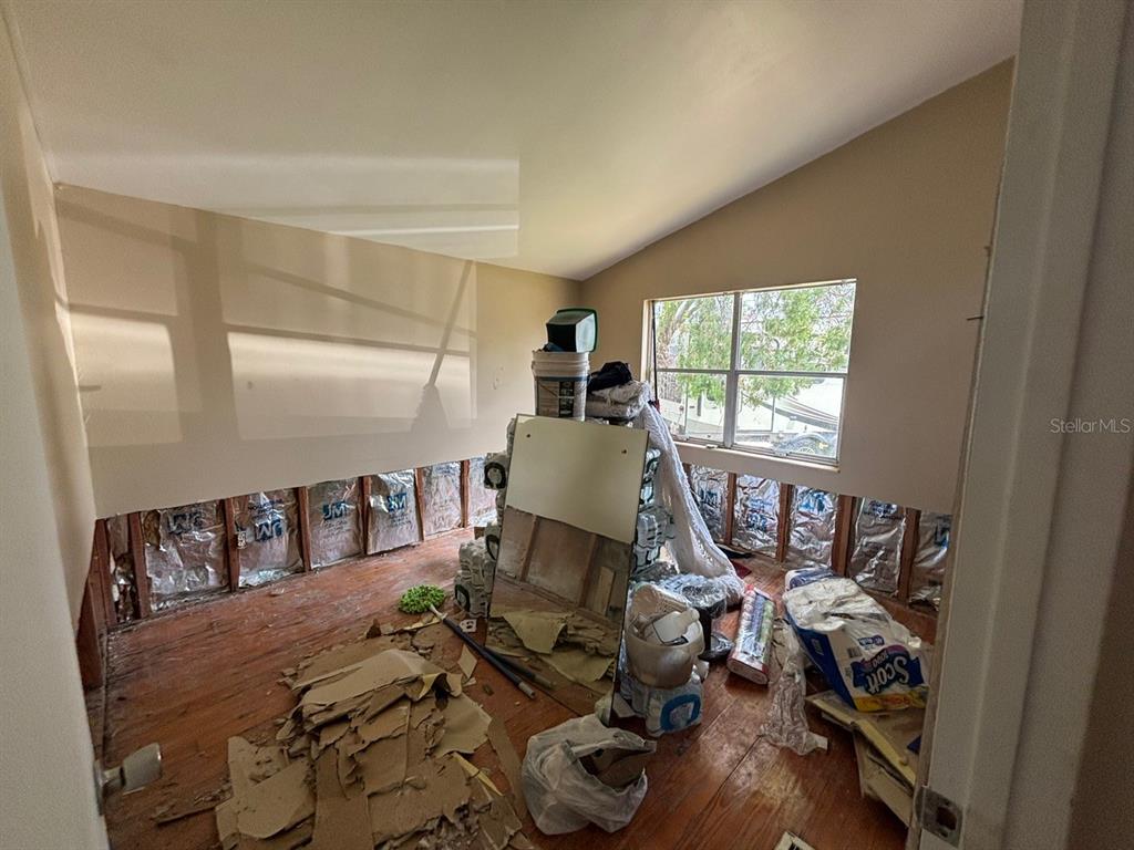 4447 Bahama Drive Hernando Beach, FL 34607 - Photo 10 of 31 a bed room with furniture and a window