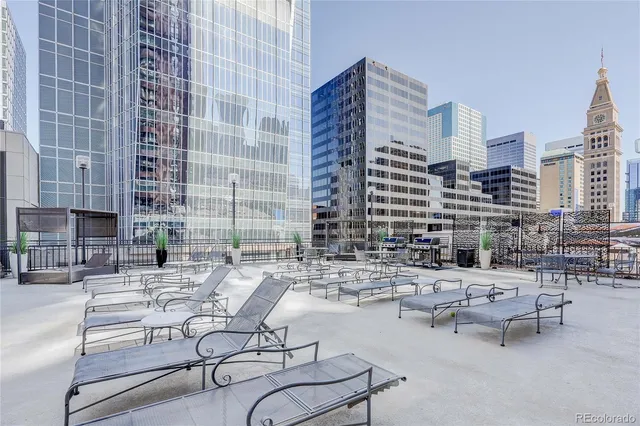 a room with furniture a table and large windows