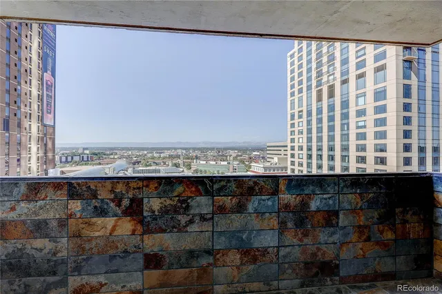 a view of balcony with potted plants
